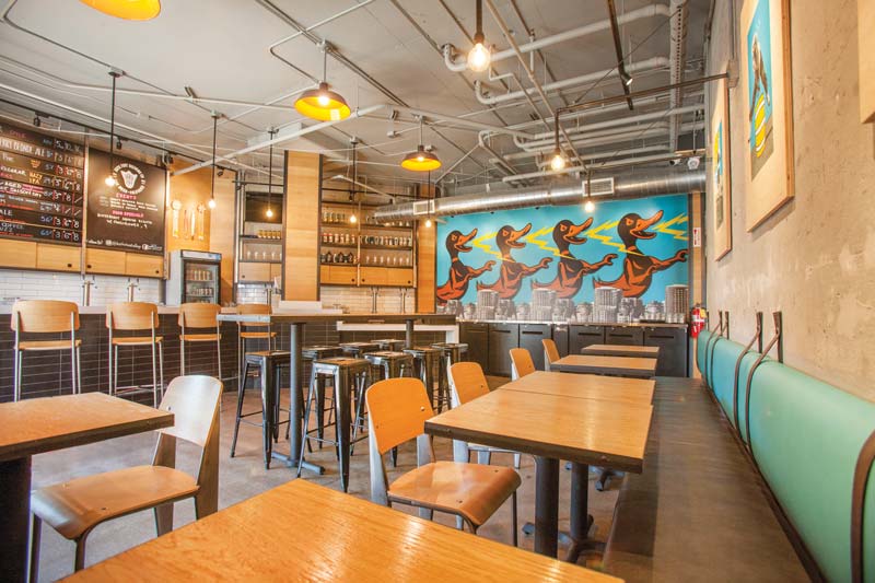 Duck Foot Brewing's taproom with mixed seating arrangements