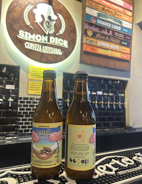 Two bottles of beer in a brewery.
