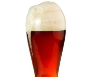 an amber or red beer with a tall rocky head in more of a hefeweizen-like glassware