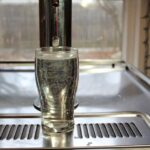 hard seltzer or hops water poured from a tap