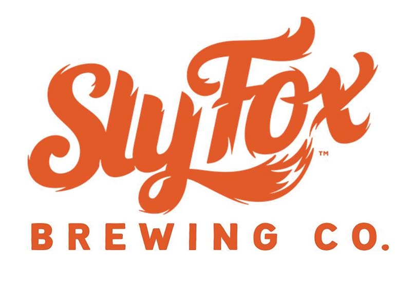sly fox brewing company's logo in orange font
