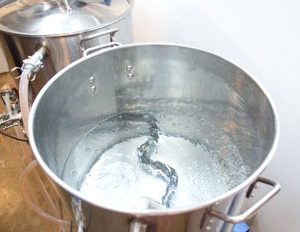 stainless steel pot with electric heating element boiling water