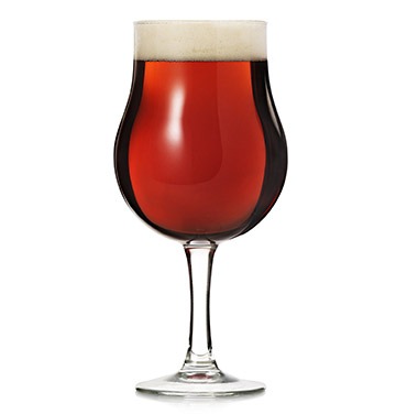 Stemmed glass of strong beer.